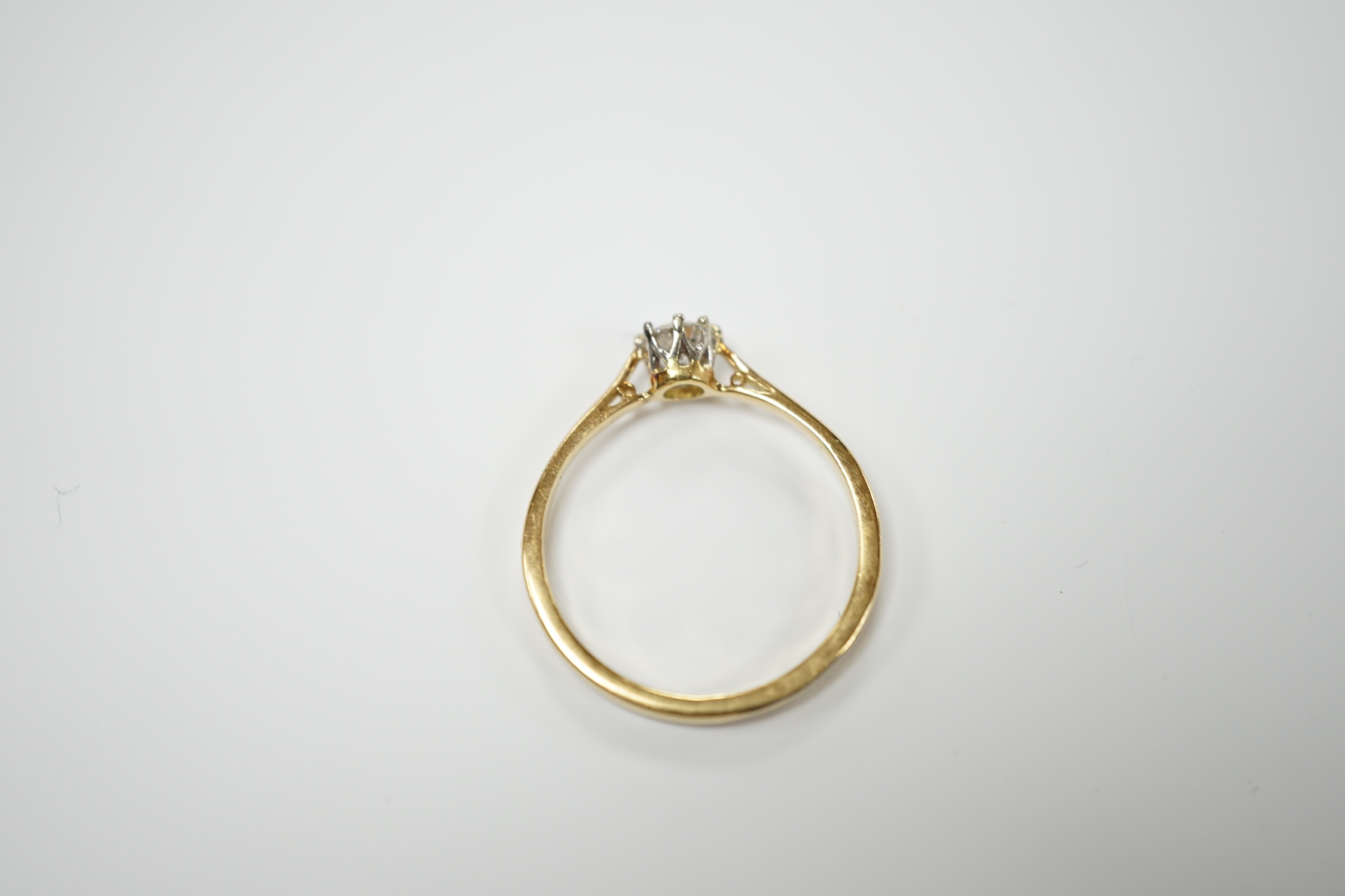 An 18ct and solitaire diamond set ring, size R, gross weight 2.8 grams.